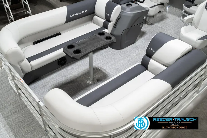 Slide: The Image of 2025 Bennington 22 SSB pontoon boat interior with plush seating and table. - 12