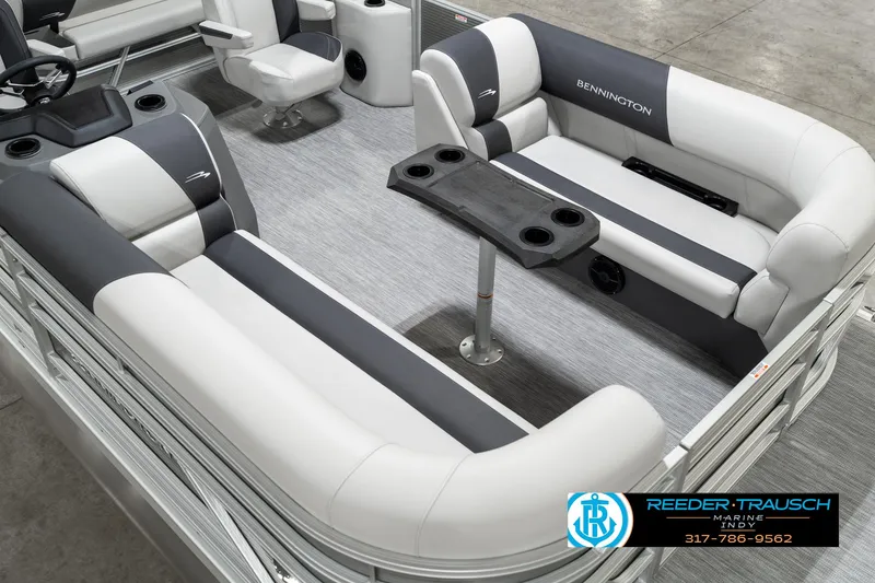 Slide: The Image of 2025 Bennington 22 SSB pontoon boat interior with gray and white seating and table. - 13