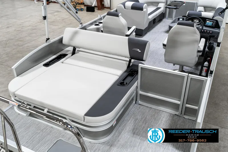 Slide: The Image of 2025 Bennington 22 SSB pontoon boat interior with modern seating and controls. - 14