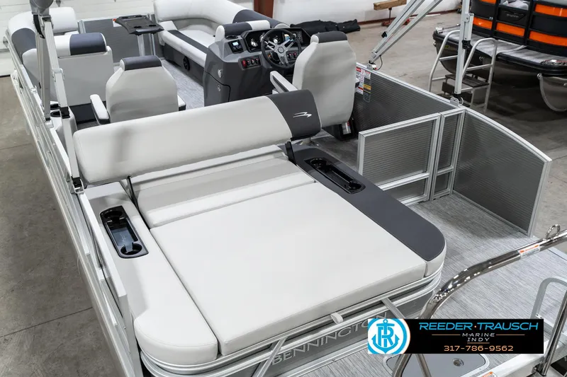 Slide: The Image of 2025 Bennington 22 SSB pontoon boat interior with plush seating and modern dashboard. - 15
