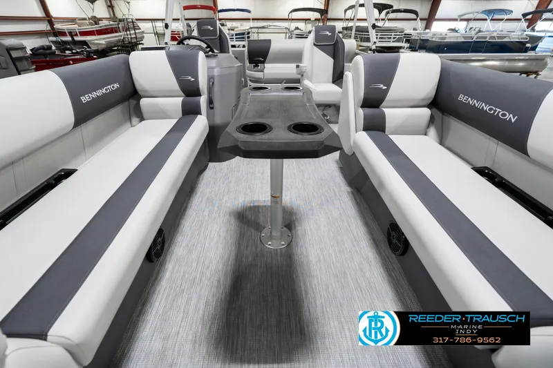 Slide: The Image of 2025 Bennington 22 SSB pontoon boat interior with gray seating and central table. - 16