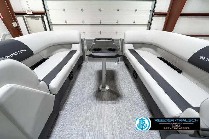 Slide: The Image of 2025 Bennington 22 SSB boat interior with gray seating and central table. - 21