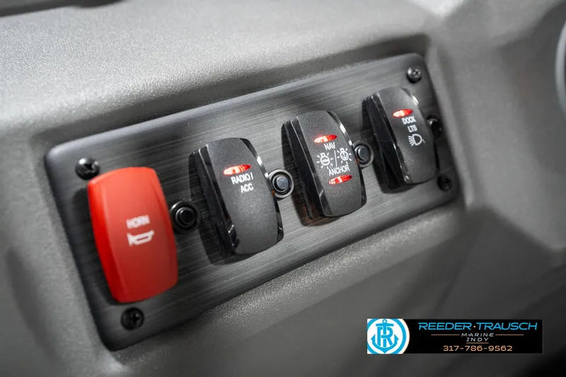 Slide: The Image of Control panel of 2025 Bennington 22 SSB boat with labeled switches. - 33