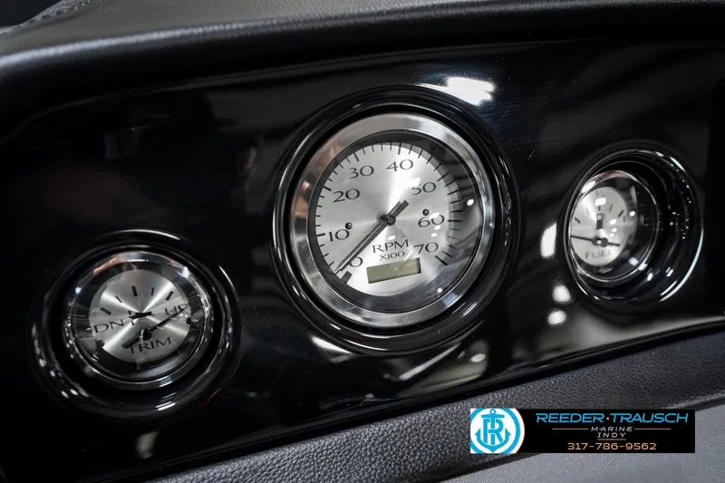 Slide: The Image of Dashboard gauges of a 2025 Bennington 22 SSB boat, featuring RPM and trim indicators. - 35