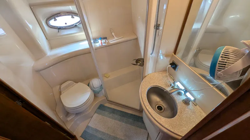 Slide: The Image of Bathroom interior of 2004 Meridian 408 Motor Yacht with shower, sink, and toilet. - 17