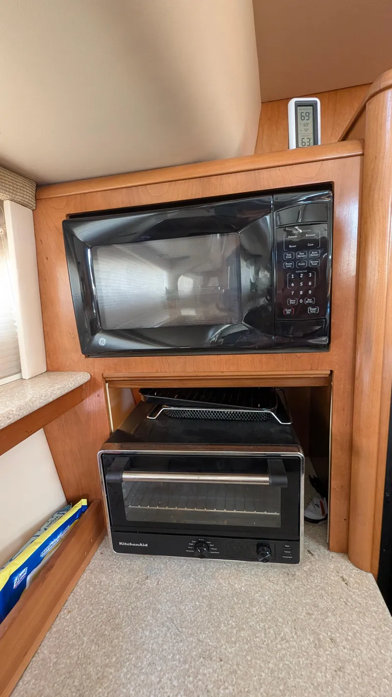 Slide: The Image of Microwave and toaster oven in 2004 Meridian 408 Motor Yacht kitchen area. - 20