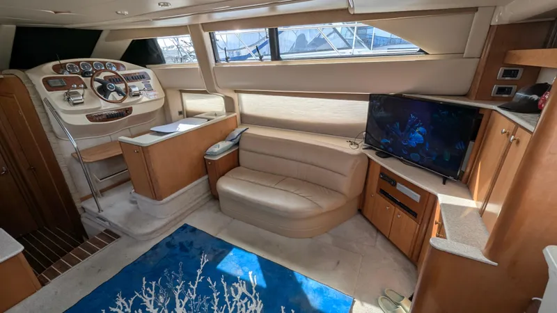Slide: The Image of Interior of 2004 Meridian 408 Motor Yacht with helm, seating, and TV. - 25