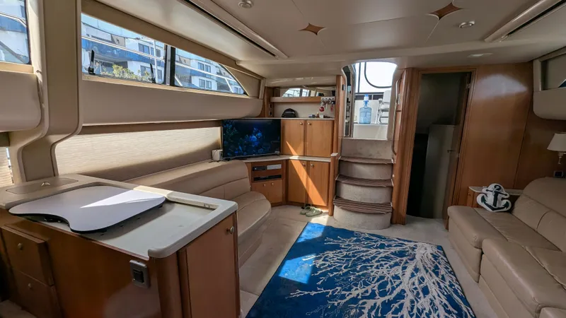 Slide: The Image of Luxurious interior of a 2004 Meridian 408 Motor Yacht with modern furnishings and natural light. - 28