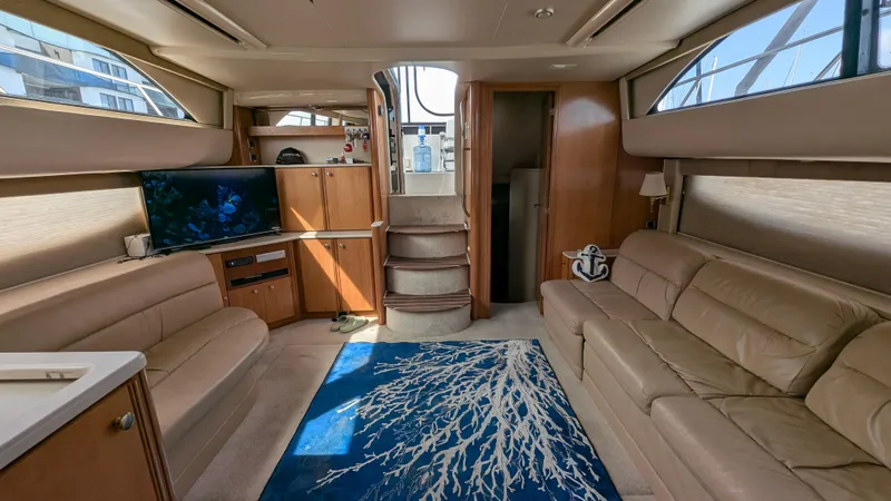 Slide: The Image of Luxurious interior of 2004 Meridian 408 Motor Yacht with plush seating and nautical decor. - 29