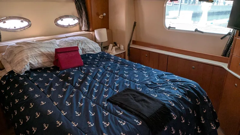 Slide: The Image of Cozy bedroom in 2004 Meridian 408 Motor Yacht with nautical-themed bedding. - 35