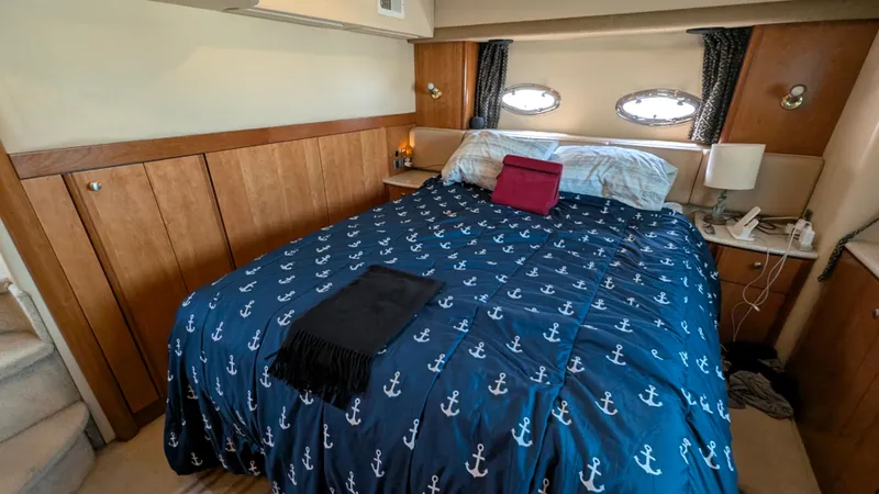 Slide: The Image of Cozy bedroom in 2004 Meridian 408 Motor Yacht with nautical-themed bedding. - 39