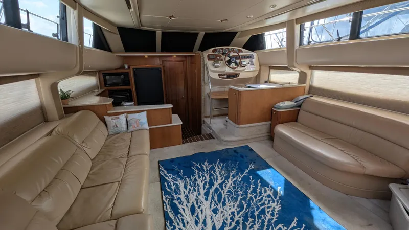Slide: The Image of Luxurious interior of a 2004 Meridian 408 Motor Yacht with beige seating and nautical decor. - 41