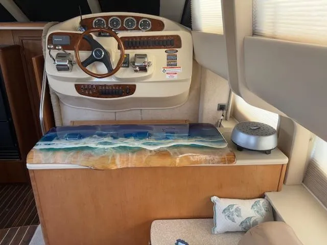Slide: The Image of Interior of 2004 Meridian 408 Motor Yacht with helm and decorative table. - 44