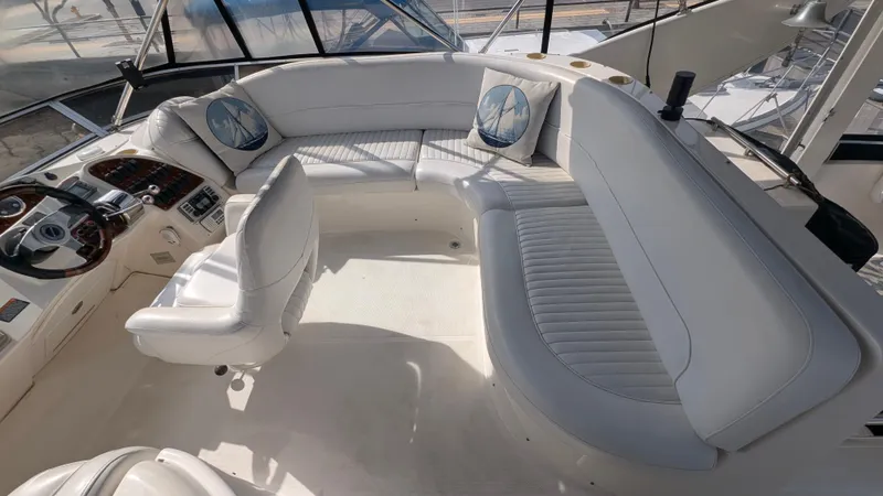 Slide: The Image of 2004 Meridian 408 Motor Yacht interior with white seating and helm station. - 9