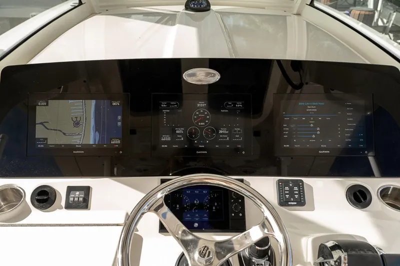 Slide: The Image of 2021 Scout 355 LXF boat dashboard with advanced navigation and control systems. - 20