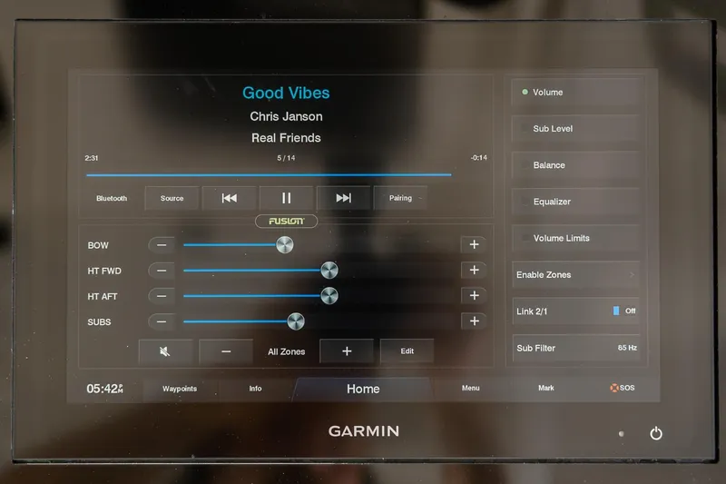 Slide: The Image of Garmin audio control display on 2021 Scout 355 LXF boat, showing music settings and song details. - 24