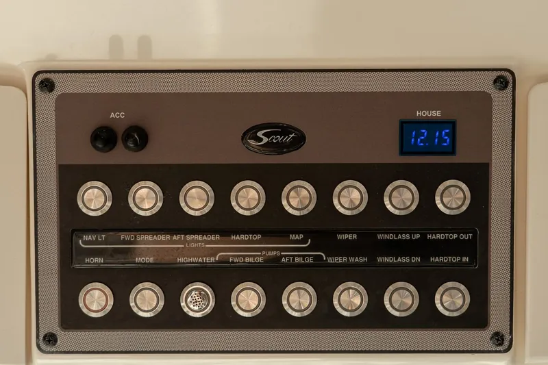 Slide: The Image of Control panel of a 2021 Scout 355 LXF boat with labeled switches and digital display. - 25