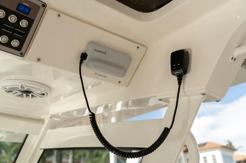 Slide: The Image of 2021 Scout 355 LXF boat interior with Garmin electronics and speaker system. - 29