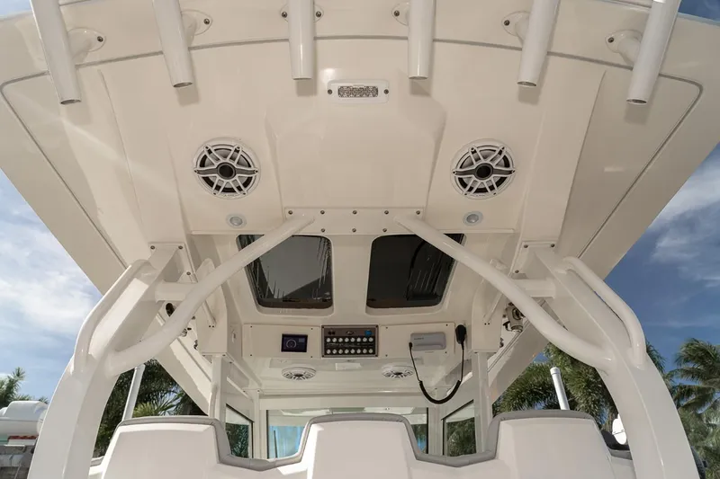 Slide: The Image of 2021 Scout 355 LXF boat interior with speakers and control panel. - 30