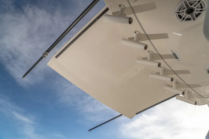 Slide: The Image of 2021 Scout 355 LXF boat detail against a blue sky background. - 31