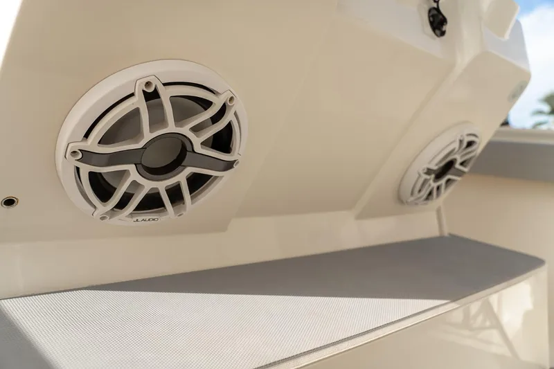 Slide: The Image of 2021 Scout 355 LXF boat speakers on deck, showcasing premium audio system. - 39