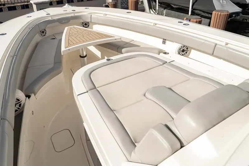 Slide: The Image of 2021 Scout 355 LXF boat interior with luxurious seating and sleek design. - 40