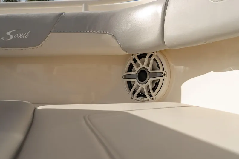 Slide: The Image of 2021 Scout 355 LXF boat interior with speaker and cushioned seating. - 42