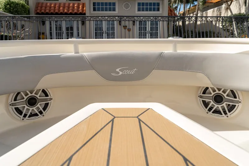 Slide: The Image of 2021 Scout 355 LXF boat interior with speakers and teak deck. - 43