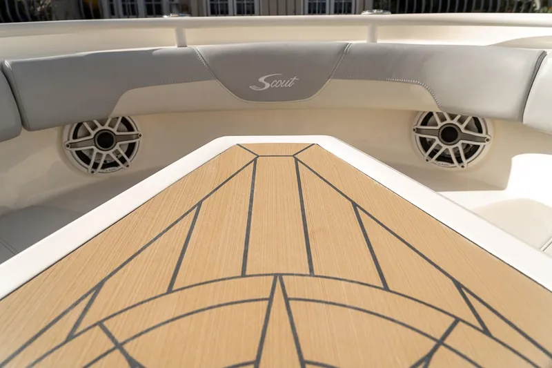 Slide: The Image of 2021 Scout 355 LXF boat interior with stylish seating and modern speaker system. - 44