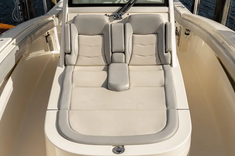 Slide: The Image of 2021 Scout 355 LXF boat with luxurious beige seating. - 45