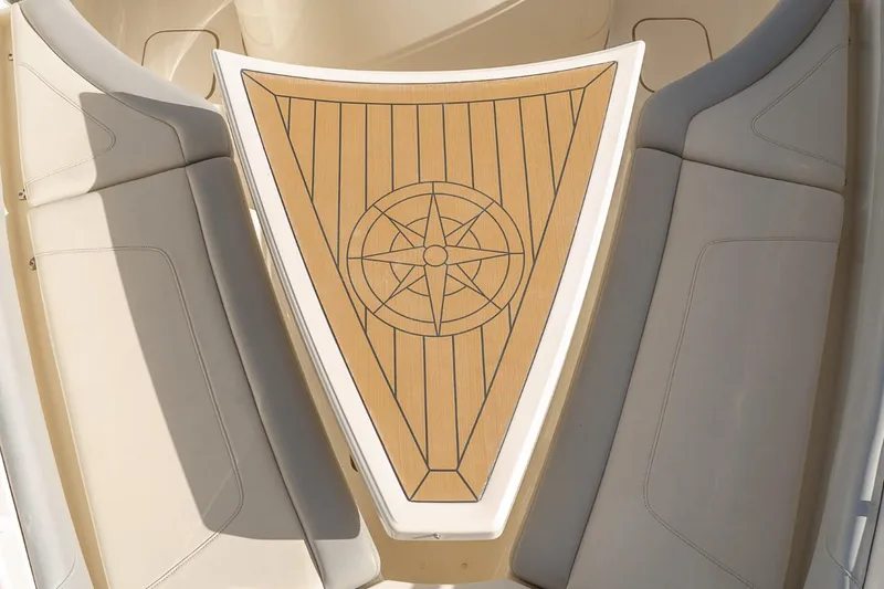 Slide: The Image of 2021 Scout 355 LXF boat interior with compass design on deck. - 48