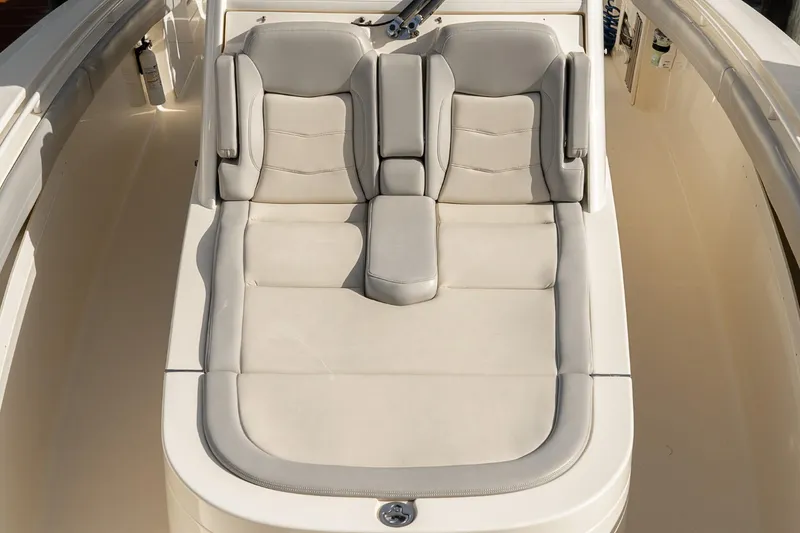 Slide: The Image of 2021 Scout 355 LXF boat with luxurious beige seating area. - 49