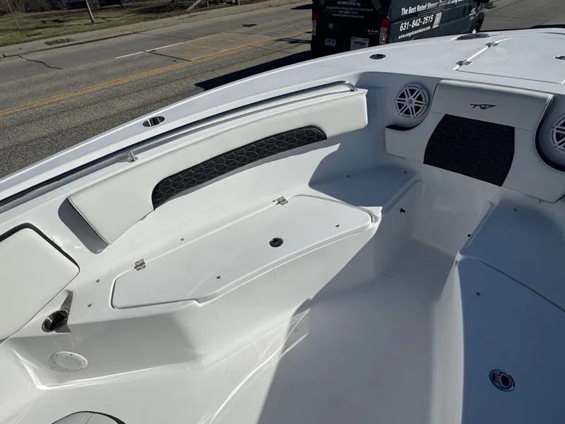 Slide: The Image of 2025 Tidewater 232 CC Adventure boat interior with seating and speakers. - 10