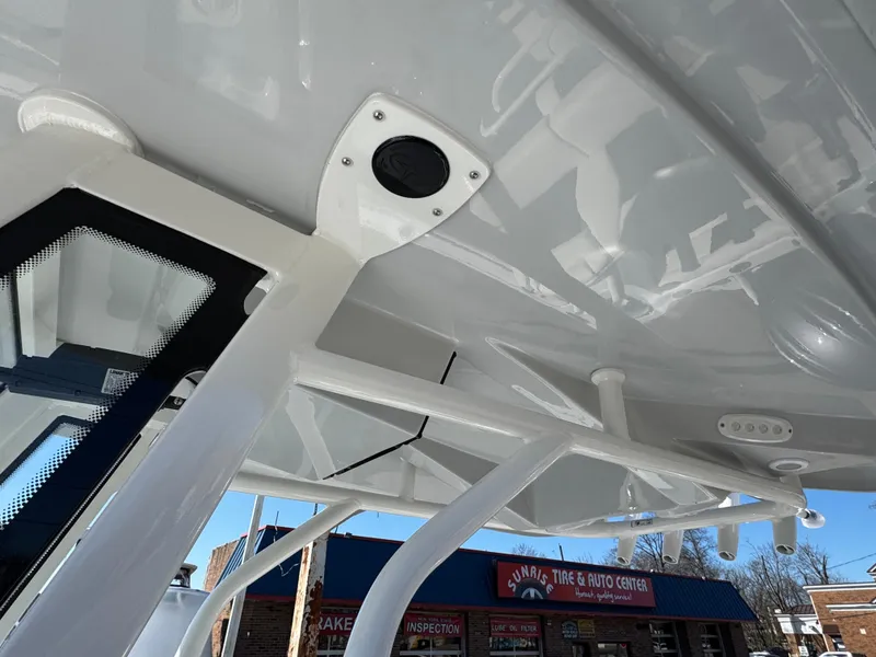 Slide: The Image of 2025 Tidewater 232 CC Adventure boat's sleek interior roof design with modern fixtures. - 13
