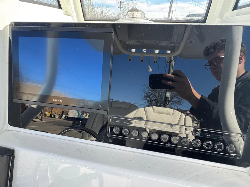 Slide: The Image of 2025 Tidewater 232 CC Adventure dashboard with Garmin display and control panel. - 5