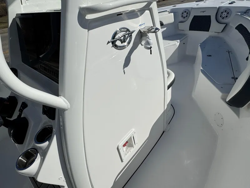 Slide: The Image of 2025 Tidewater 232 CC Adventure boat interior, featuring sleek white design and modern amenities. - 7