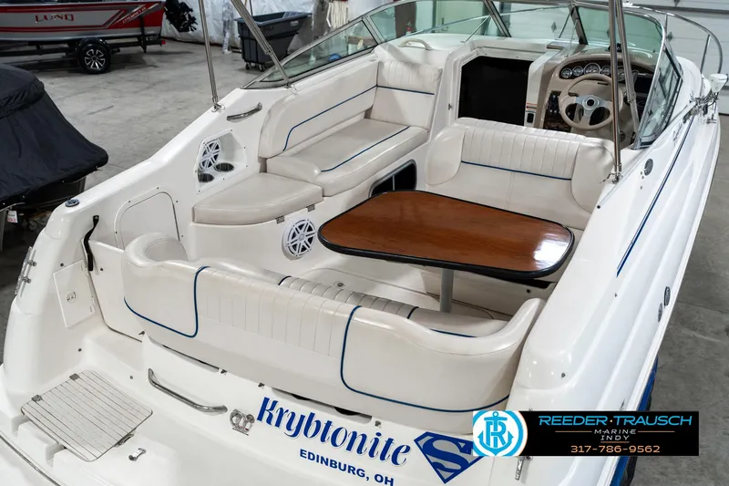 Slide: The Image of 2000 Chaparral Signature 240 boat interior with seating and table, labeled "Kryptonite," Edinburg, OH. - 13
