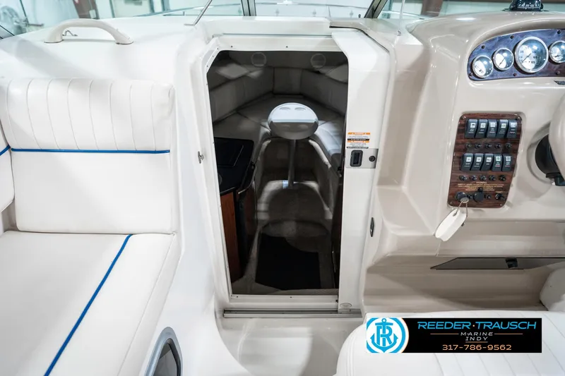 Slide: The Image of 2000 Chaparral Signature 240 boat interior with seating and control panel. - 27