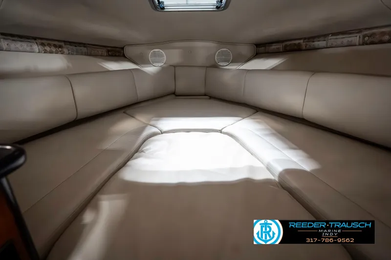 Slide: The Image of Interior cabin of 2000 Chaparral Signature 240 boat, featuring beige upholstery. - 34