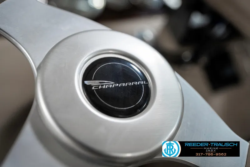 Slide: The Image of Steering wheel of 2000 Chaparral Signature 240 boat with logo detail. - 39