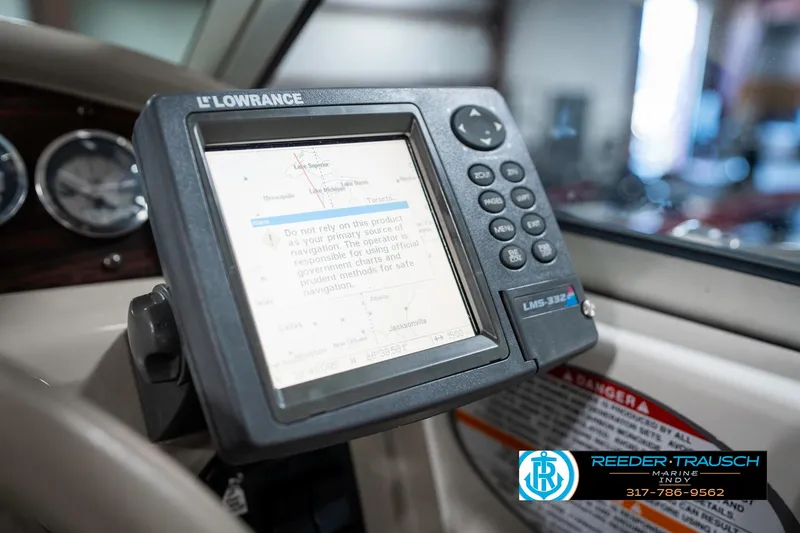 Slide: The Image of Chaparral Signature 240 (2000) dashboard with Lowrance GPS system, Reeder-Trausch logo visible. - 45