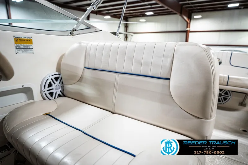 Slide: The Image of Chaparral Signature 240 boat interior, 2000 model, featuring beige seating and speaker. - 47