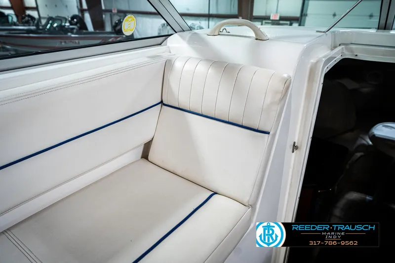 Slide: The Image of 2000 Chaparral Signature 240 boat interior with white seating and blue accents. - 49