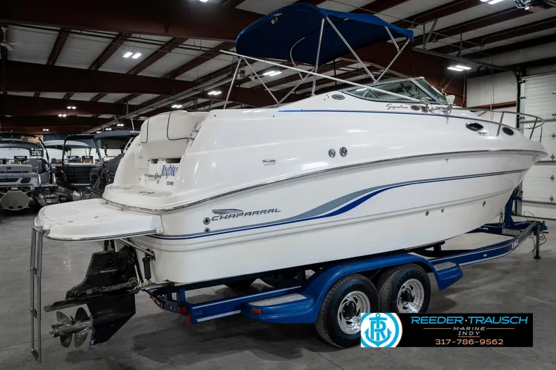 Slide: The Image of 2000 Chaparral Signature 240 boat on trailer in indoor showroom. - 7