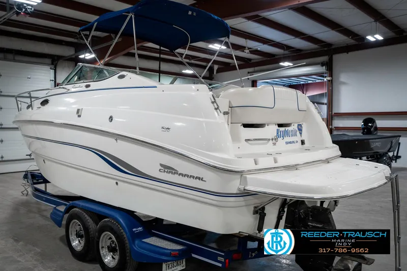 Slide: The Image of 2000 Chaparral Signature 240 boat on trailer in indoor storage facility. - 9