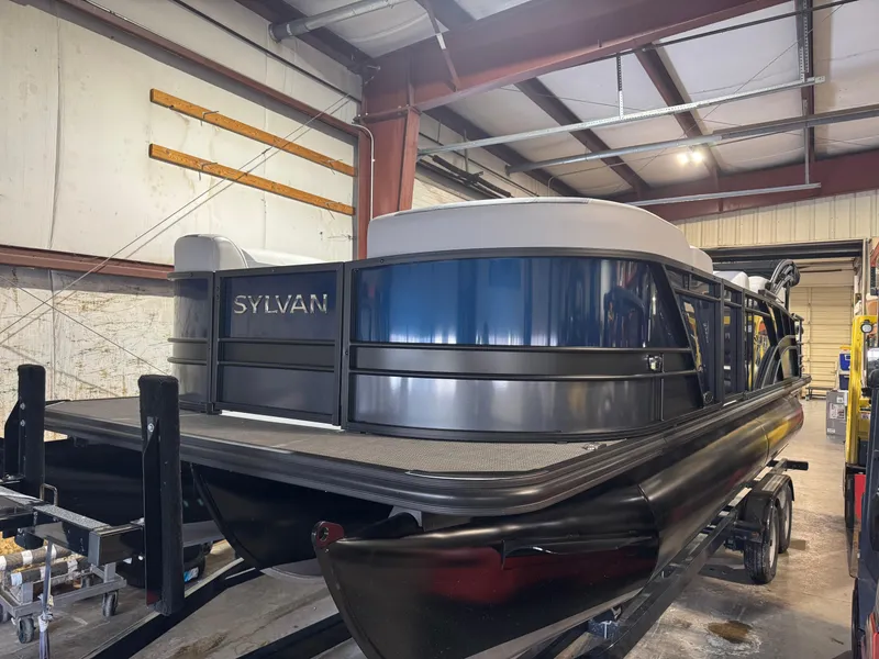 The Image of 2025 Sylvan L3 CLZ pontoon boat in a warehouse setting. - 0