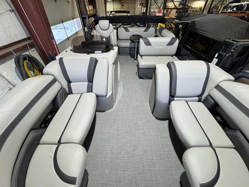 Slide: The Image of 2025 Sylvan L3 CLZ pontoon boat interior with luxurious seating and modern design. - 2