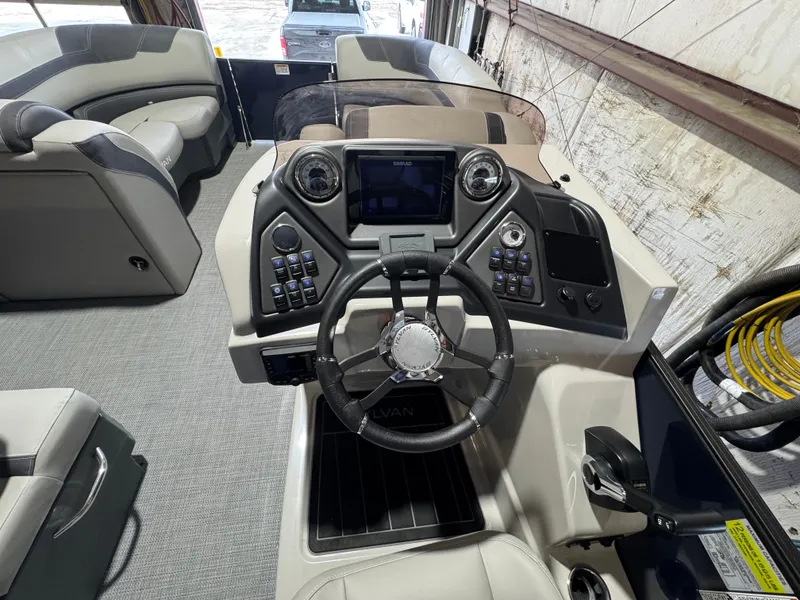 Slide: The Image of 2025 Sylvan L3 CLZ boat dashboard with steering wheel and control panel. - 6