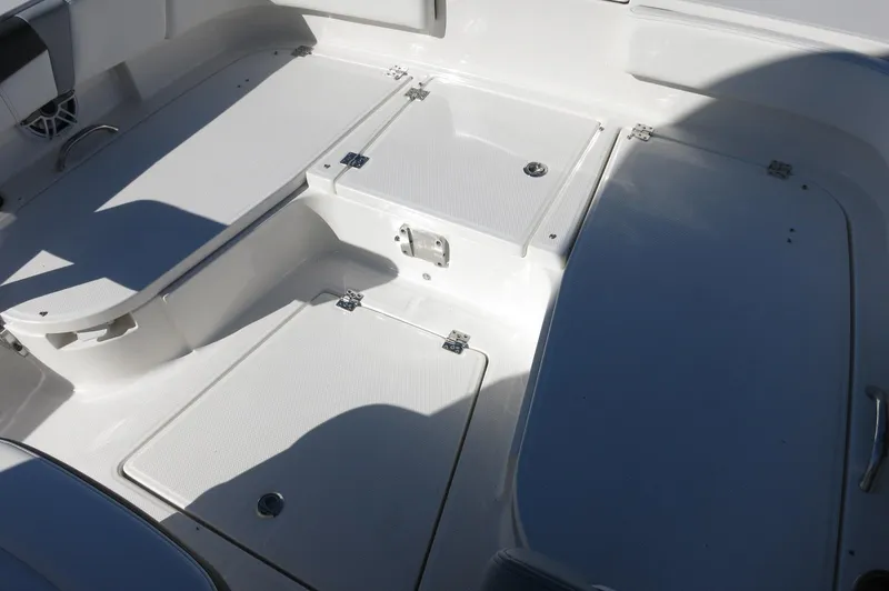 Slide: The Image of 2025 Robalo 266 Cayman boat deck with storage compartments. - 17