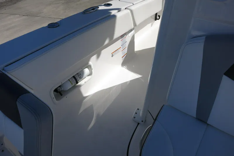 Slide: The Image of 2025 Robalo 266 Cayman boat interior with seating and safety equipment. - 29